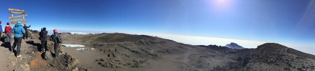 Looking out over the 2.5km caldera of Uhuru Peak. In the caldera you can see the melting remnants of the Furtwangler Glacier, the Inner Cone and Reusch Crater with he Northern Ice Field in the distance.