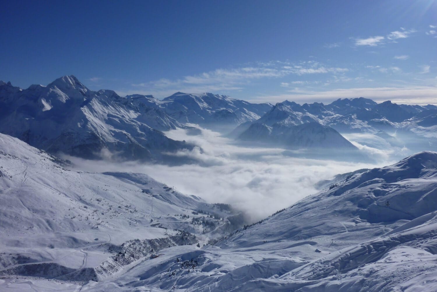 skiing above cloud tignes